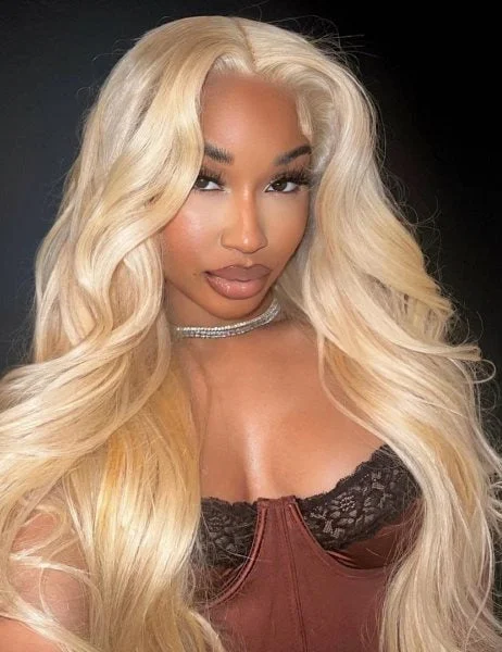 Colored wig with a wispy fringe for a soft and feminine lookSimidola 613 Blonde Body Wave Human Hair Wig