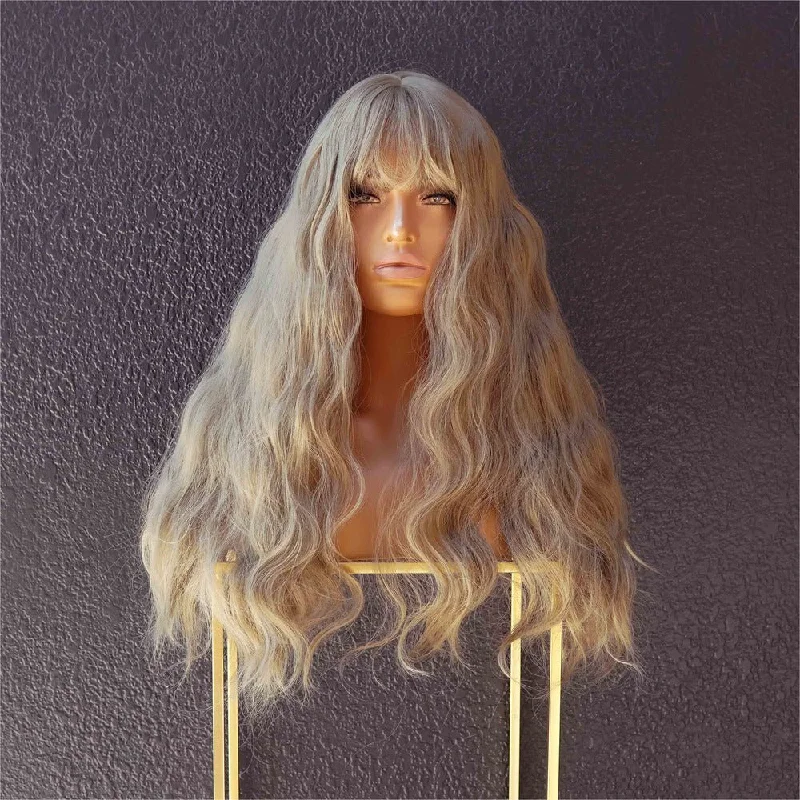 Wavy wig with a wispy fringe for a soft and feminine lookCHARLIE Moss Fringe Wig