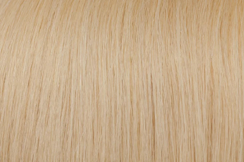 Clip - in hair extensions with a side - part for a more flattering lookSeamless Clip-In Extensions: Ash Lightest Blonde #60