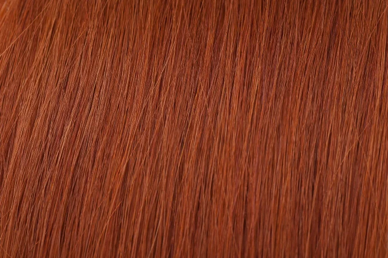 Clip - in hair extensions with a side - part for a more flattering lookSeamless Clip-In Extensions: Copper