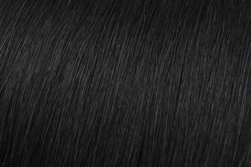 Clip - in hair extensions with a wispy fringe for a soft and feminine lookSeamless Clip-In Extensions: Jet Black #1